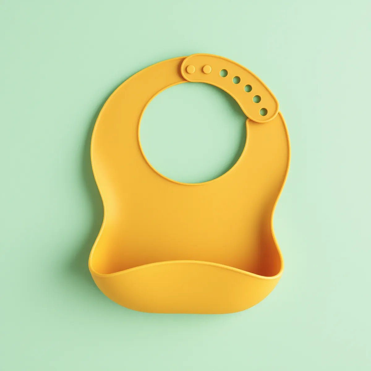 Bavoir silicone à récupérateur — Moutarde — vue détourée